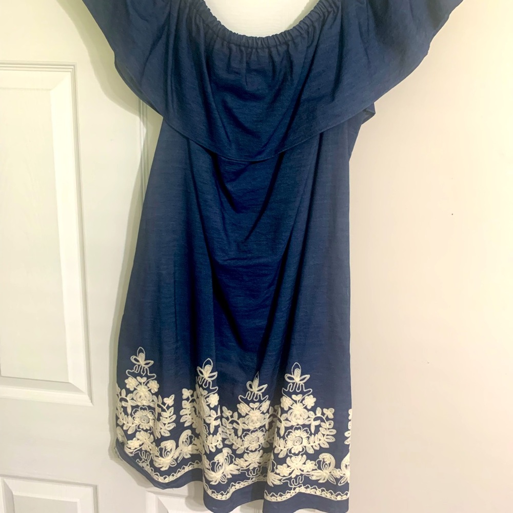 Off shoulder dress. Light denim material with design.